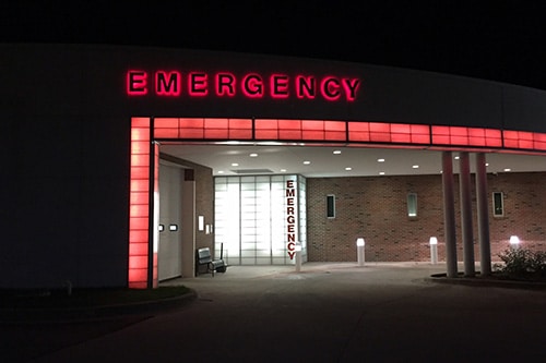 HCCH emergency room entrance lit up at night