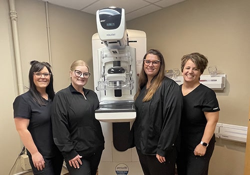 The HCCH 3D Mammography team standing by diagnostic equipment