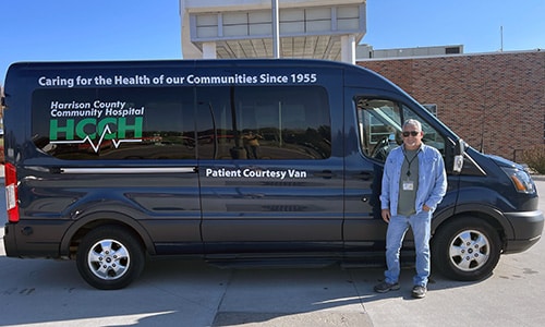 The Courtesy Van and driver outside HCCH